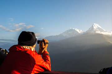 The back of traveler  enjoying morning with Annapurna mountain range