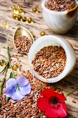 Linseed on wooden background