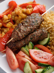 Kebabs with bulgur and vegetables