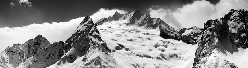 Obraz premium Black and white panorama of snow maintain at winter