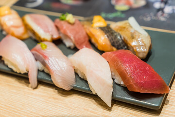 Premium Sushi Set Hamachi, Hotate, Toro on Black Stone Plate