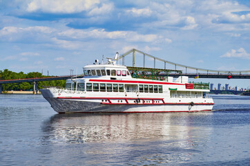Tourist boat on the river quay in Kiev on a tour of the Dnieper, Kiev, Ukraine.