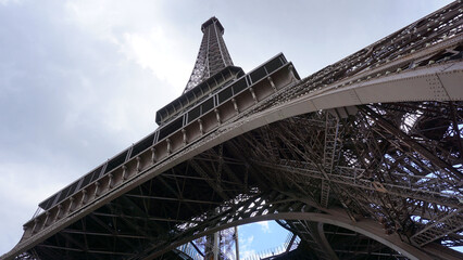 Fototapeta na wymiar Photo of Eiffel tower on a cloudy spring day, Paris, France