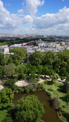 Fototapeta na wymiar Aerial view of gardens from Eiffel tower with beautiful scattered clouds, Paris, France