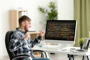 Young programmer at workplace
