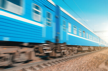 Obraz premium Passenger cars passing by at high speed railway.