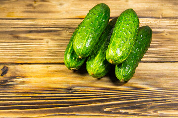 Fresh cucumbers on wooden table
