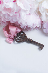 Skeleton key with peony flowers with copy space - love and wedding concept