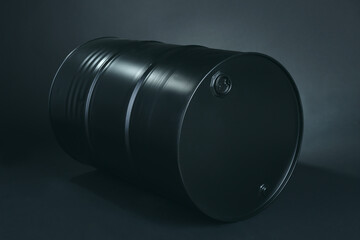 Black oil barrel on dark background