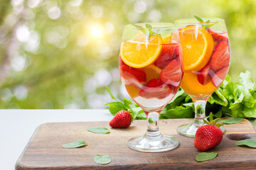 Flavored water with fresh strawberries .