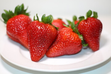 Strawberries on white plate