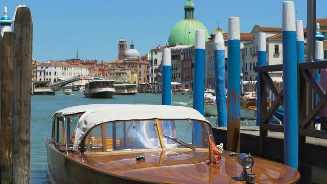 Water transport in Venice, beautiful motorboat floating in Grand Canal, tour