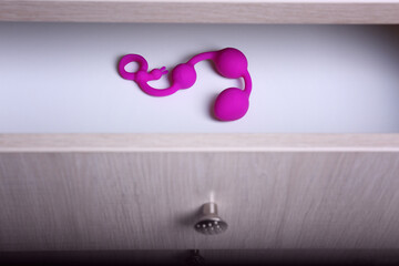 Pink anal balls in drawer