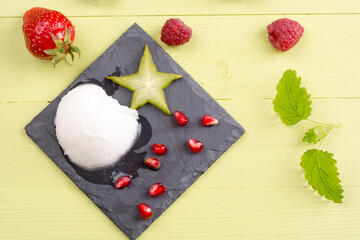 Refreshing frozen sorbet on table with fresh fruits