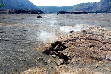 Steaming vents on the Kilauea Iki volcano crater surface with crumbling lava rocks in Volcanoes National Park in Big Island of Hawaii