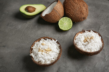 Tasty rice in coconut shell on table