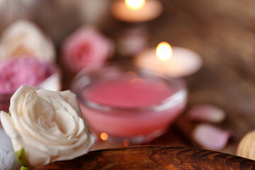 Beautiful spa composition with rose on blurred background