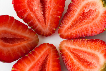  halves of a strawberry on a white background. top view.