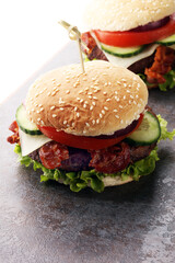 fresh tasty burger on wooden grey background