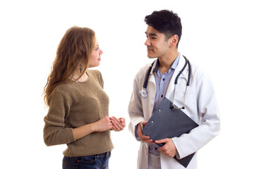 Male doctor talking to young woman 