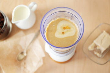 Freshly cooked coffee with butter in blender cup