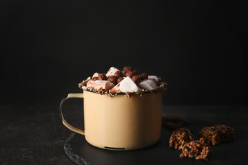 Cup of cocoa with marshmallows on table