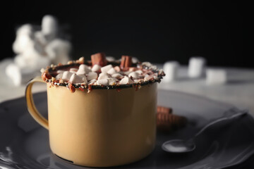 Cup of cocoa with marshmallows on vintage plate