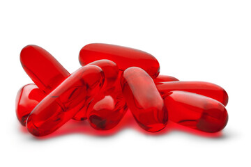 Red medical pill on a white isolated background