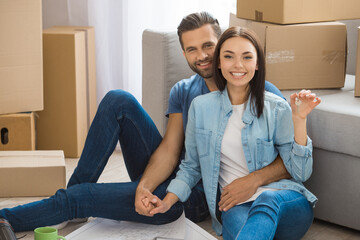 Young couple moving to a new apartment together relocation
