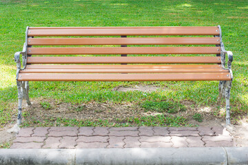 The old wooden chairs in the park with morning sunlight.