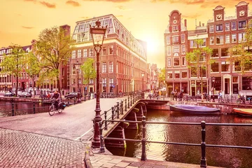 Foto op Aluminium Channel in Amsterdam Netherlands Holland houses under river © Yasonya