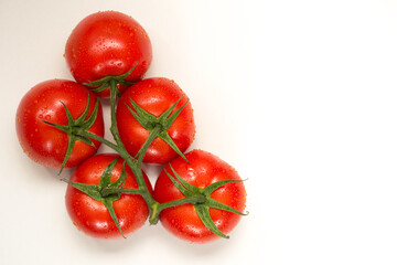 Red fresh tomatoes isolated on white background