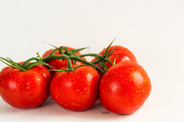 Red fresh tomatoes isolated on white background