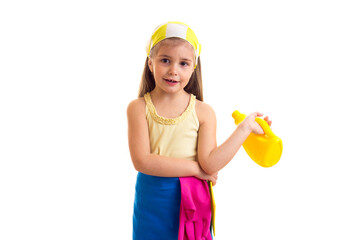 Girl in apron with bottle and duster 