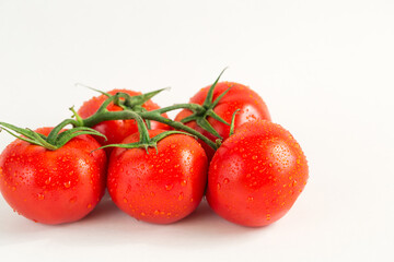 Red fresh tomatoes isolated on white background