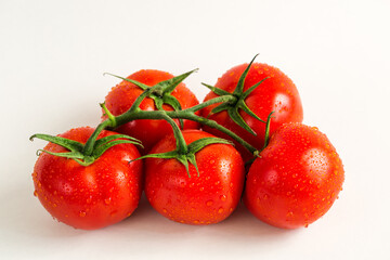 Red fresh tomatoes isolated on white background