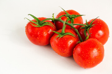 Red fresh tomatoes isolated on white background