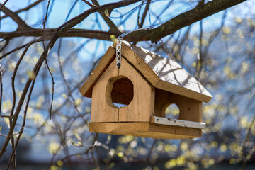 wooden birdhouse on a tree