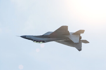 Fototapeta na wymiar Combat aircraft fighter jet fly upside down.