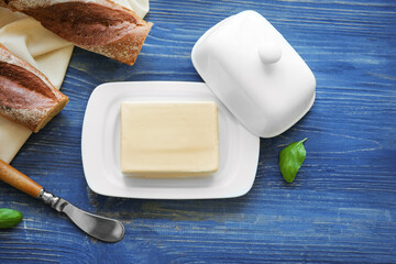Composition with butter on wooden table