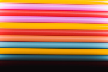 Abstract background from many multi-color straws.