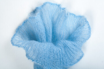 Knitting mohair wool and knitting needles for handmade on wooden table. Blue Flower.