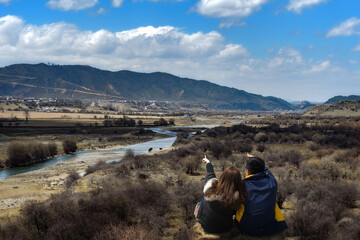 A couple watching the scenery in Shangri La,Yunnan,China.