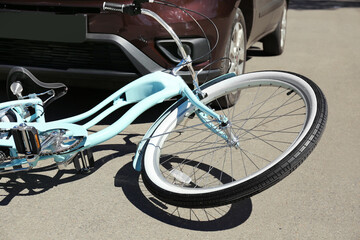 Car and bicycle accident on road of city street