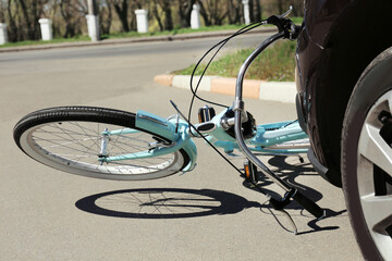 Car and bicycle accident on road of city street