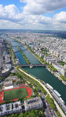 Obraz premium Aerial view of river Seine from Eiffel tower with beautiful scattered clouds, Paris, France