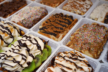 Delicious dessert with whipped cream on showcase