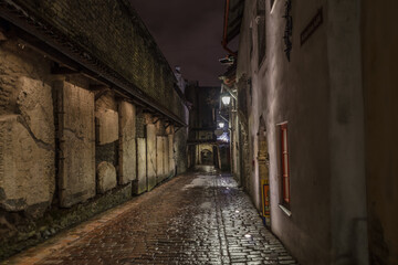 Fototapeta na wymiar Medieval street at night. Historical center of Tallinn, Estonia,