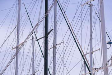 Masts of ships and sailboats against the sky