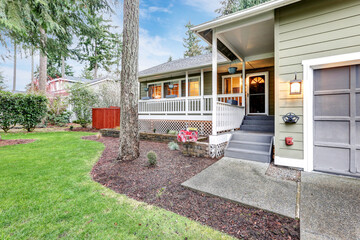 Lovely home exterior with welcoming covered porch